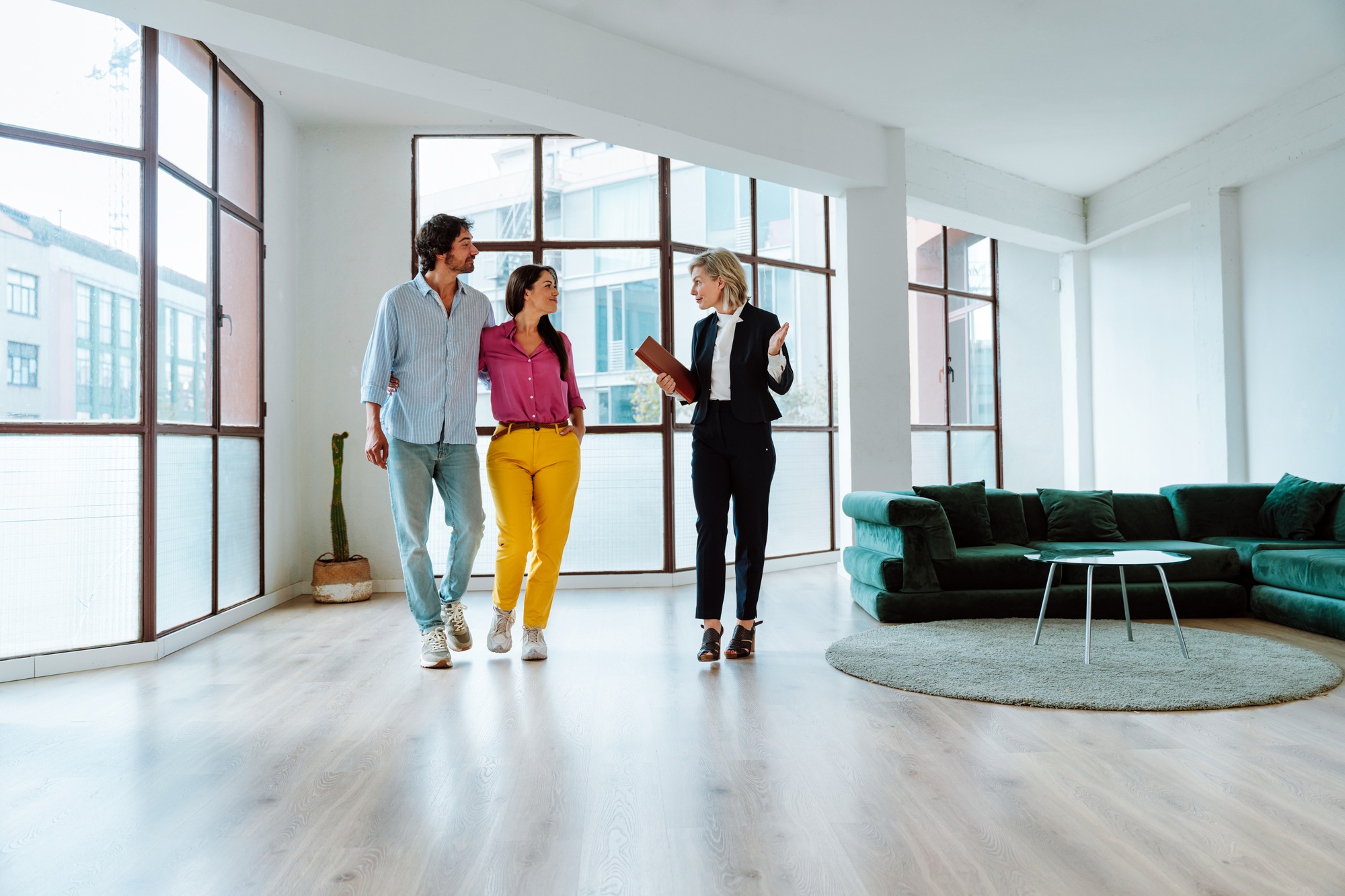 Real estate agent showing an apartment to a couple.